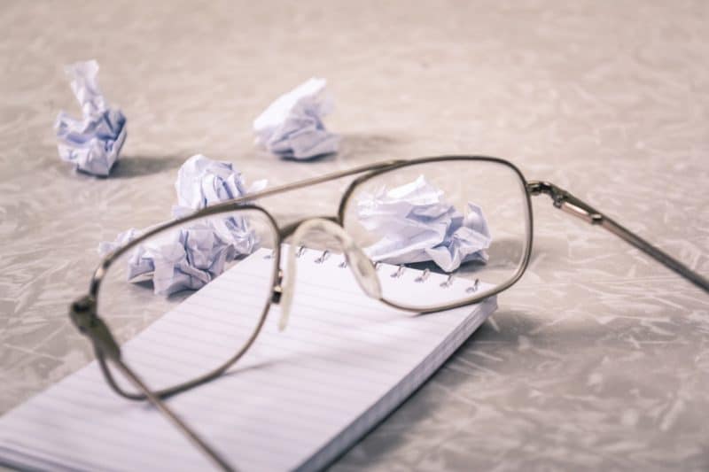 glasses with balled up paper to indicate customer frustration and use it to build your USP