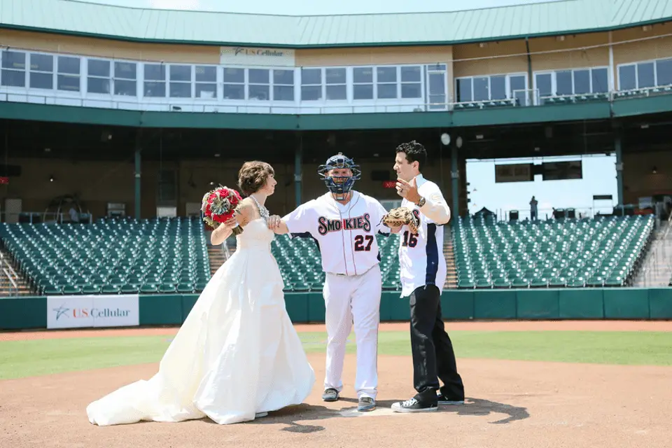 picture of a couple getting married on a baseball field