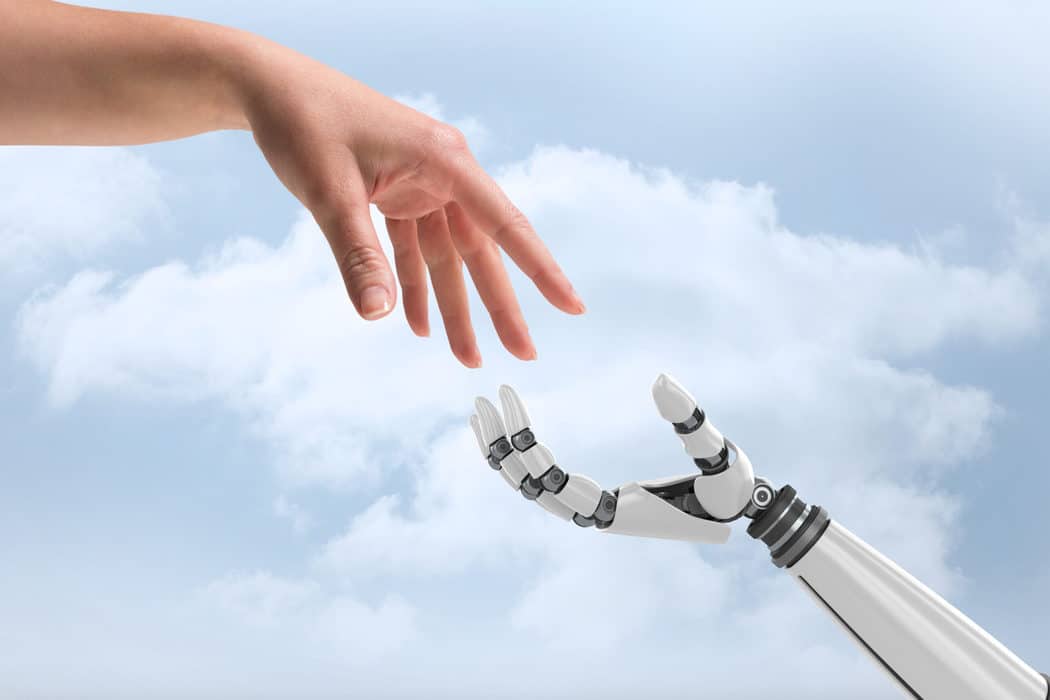 human hand reaching for robot hand ai writer