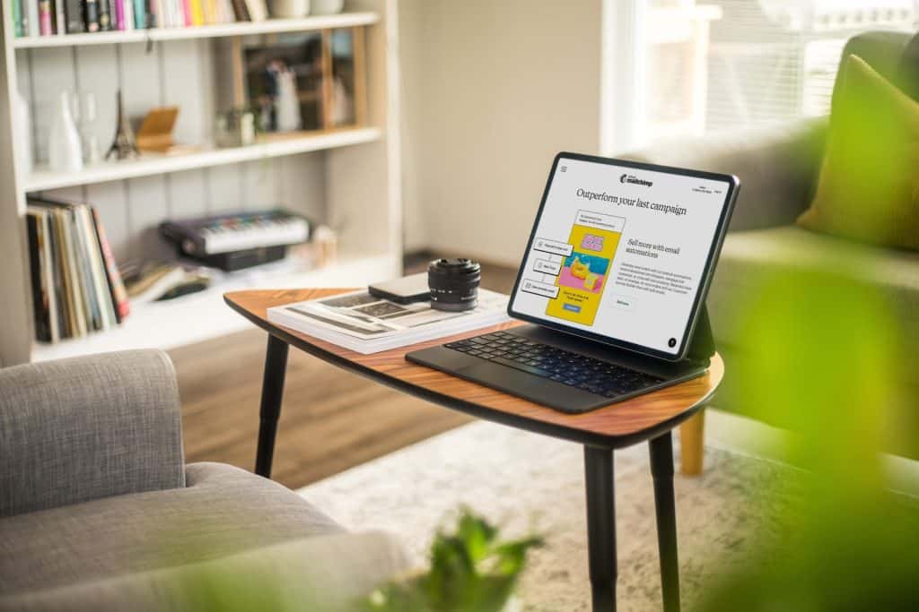 a laptop on a coffee table - ai seo strategy