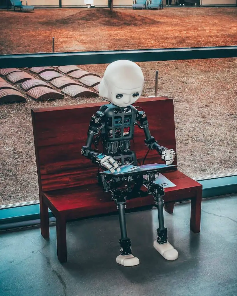 black and white robot toy on red wooden table - copyright on ai generated content