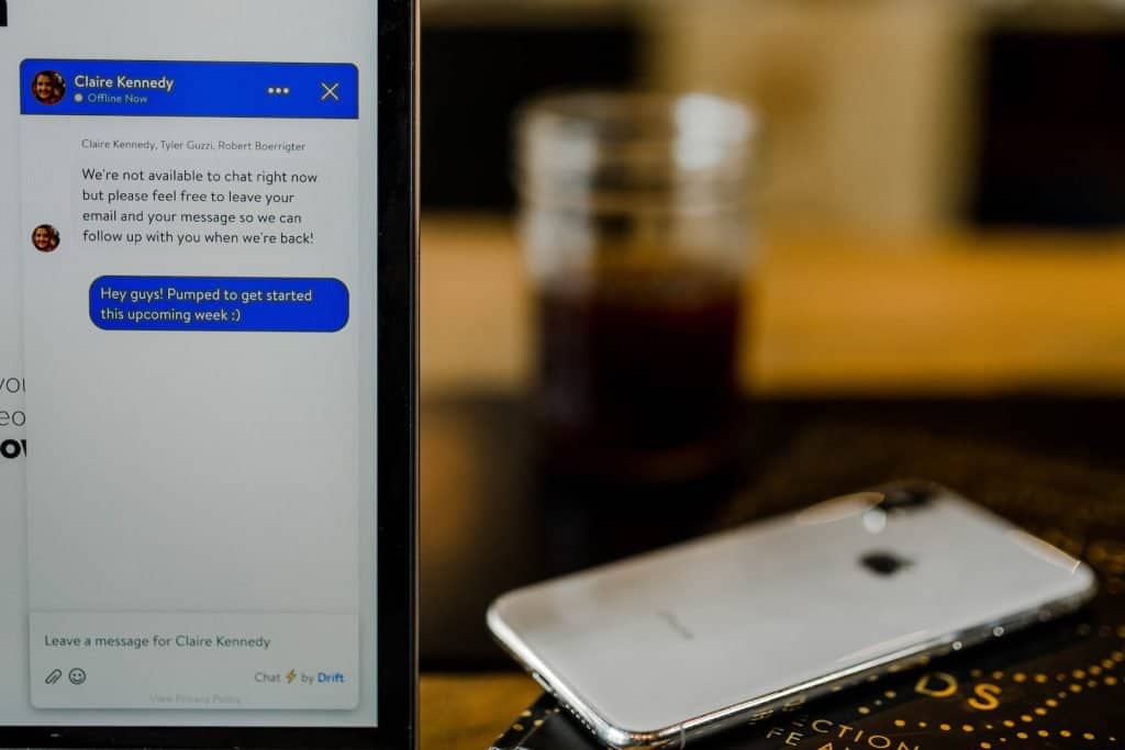 silver iPhone X on brown surfacechatbot for lead generation