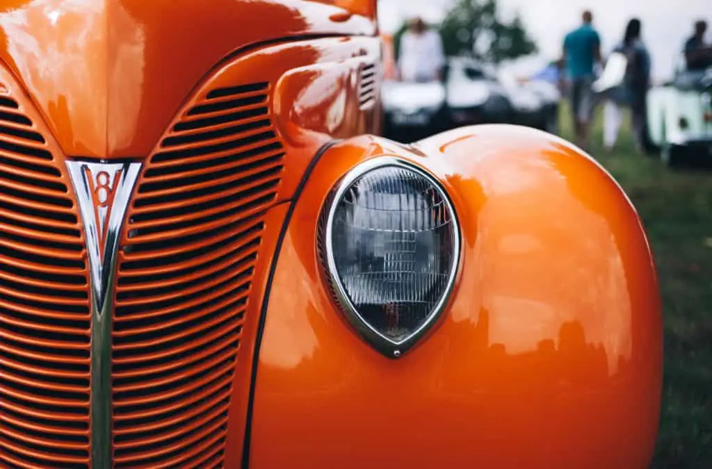 vintage orangish car during daytime - advertizing pinch car wrap