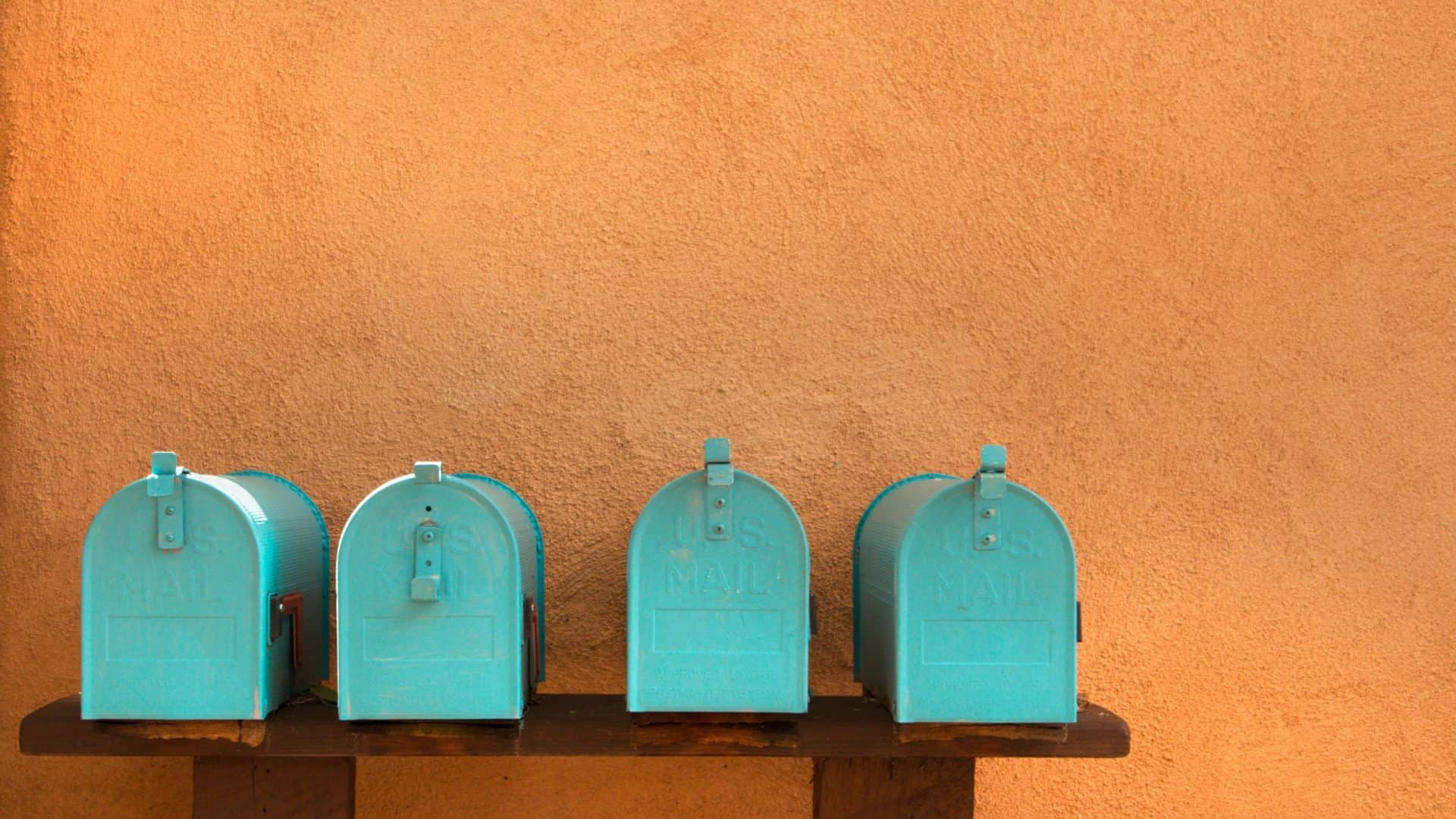 Direct Mail Small Business ROI Row of blue mailboxes on wall