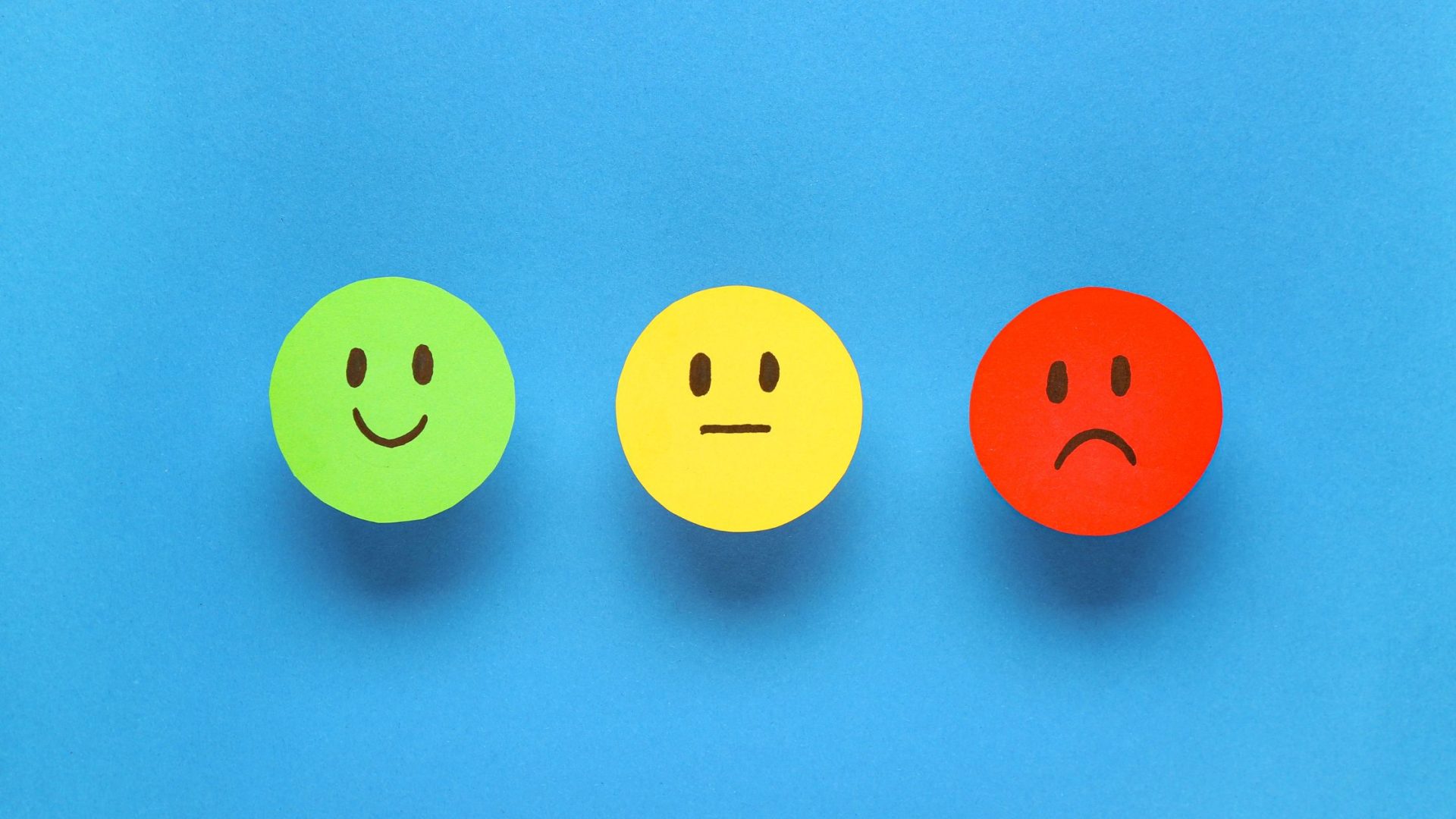 Why Customers Leave Big Companies for Small Business  - emoji face ranking on blue background