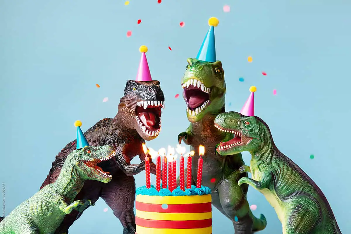 personalized marketing strategy - Group of dinosaur friends celebrating at a birthday party with birthday cake and confetti