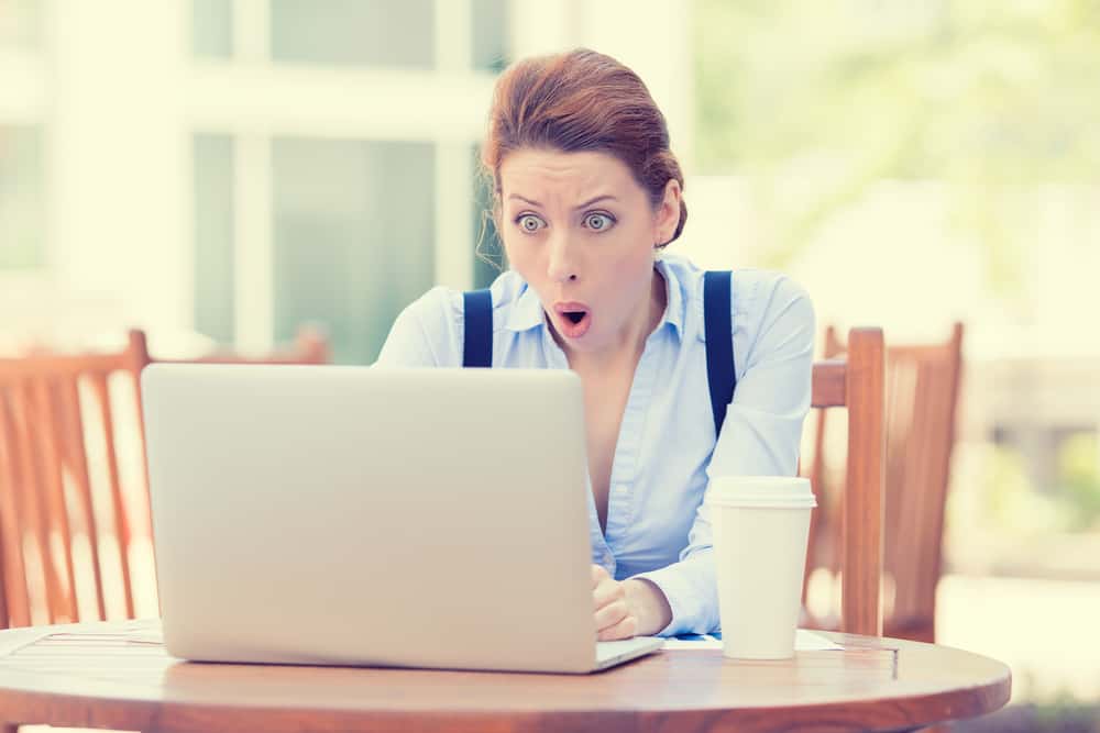 woman behind computer checking email