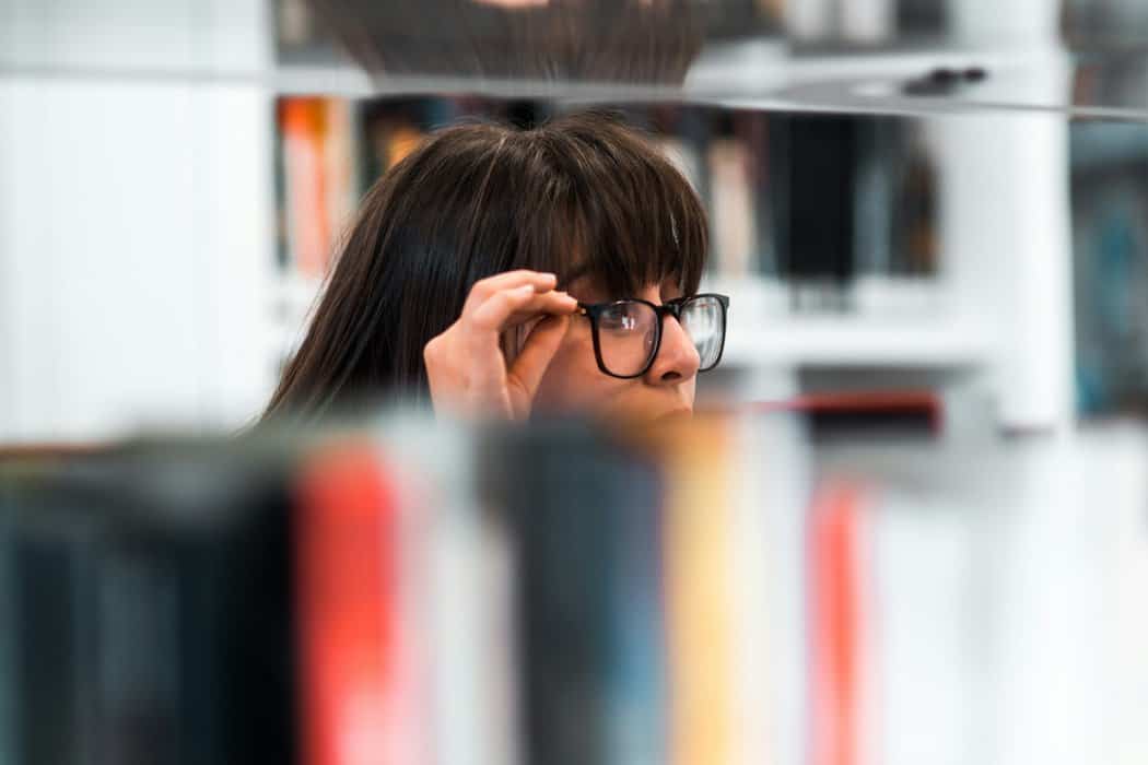 woman wearing eyeglasses - ways to find your ideal customer