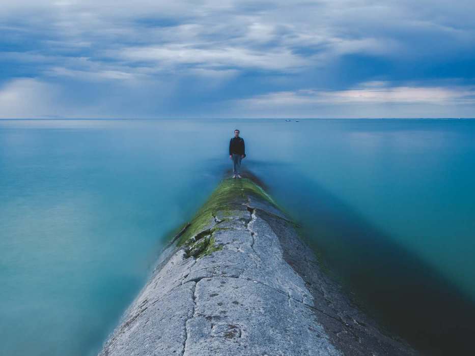 man at the end of a pier