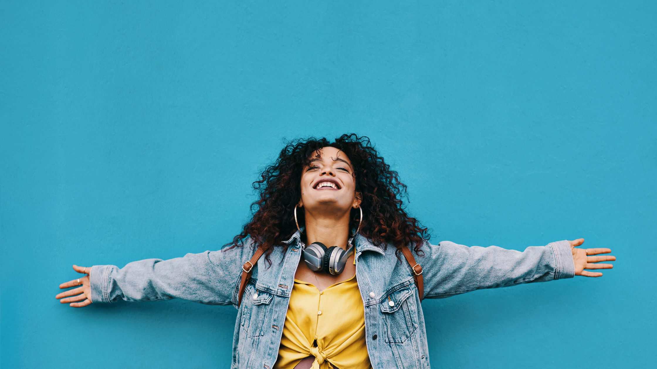 free crm for smmall business Woman smiling against blue background.