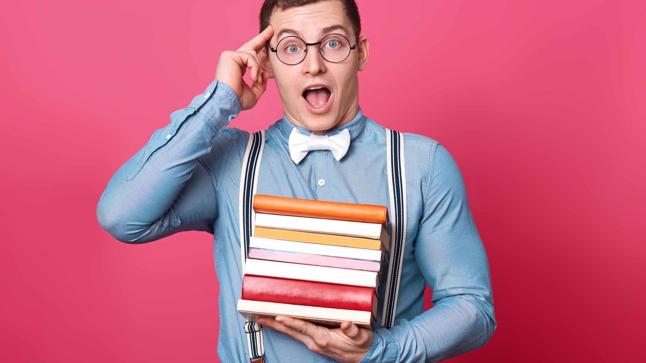 guerilla marketing ideas for small business - man holding books getting a great idea