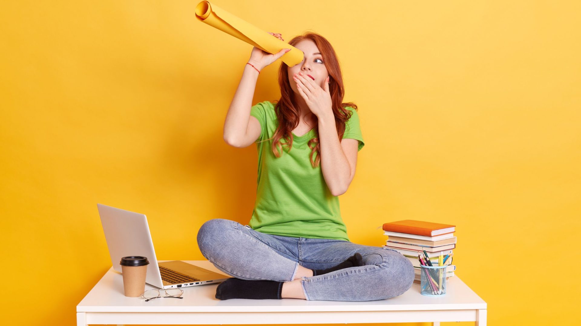 how to identify business opportunities Woman sitting with laptop and papers