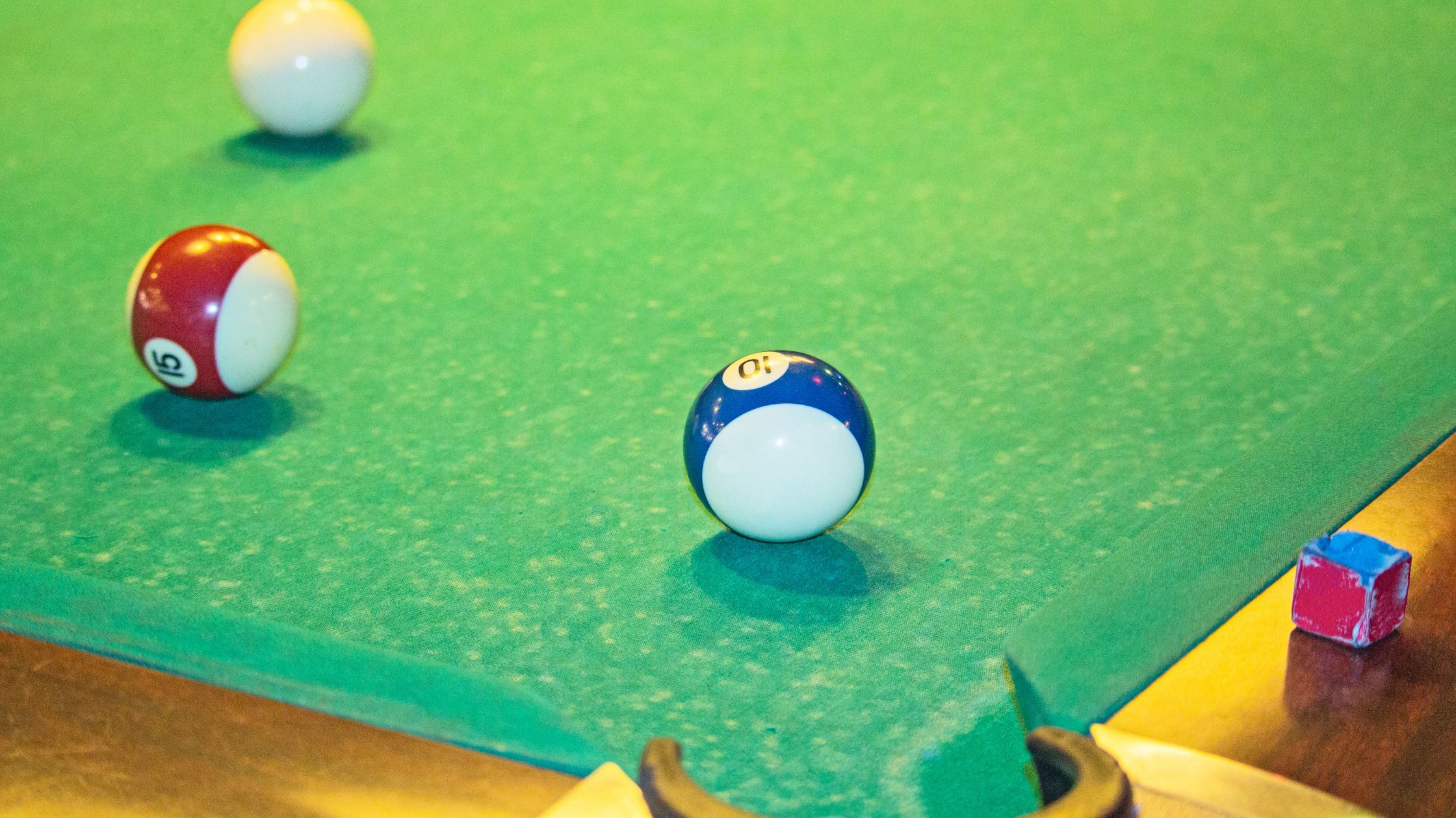 how to position your service as essential Billiard balls on a green table.