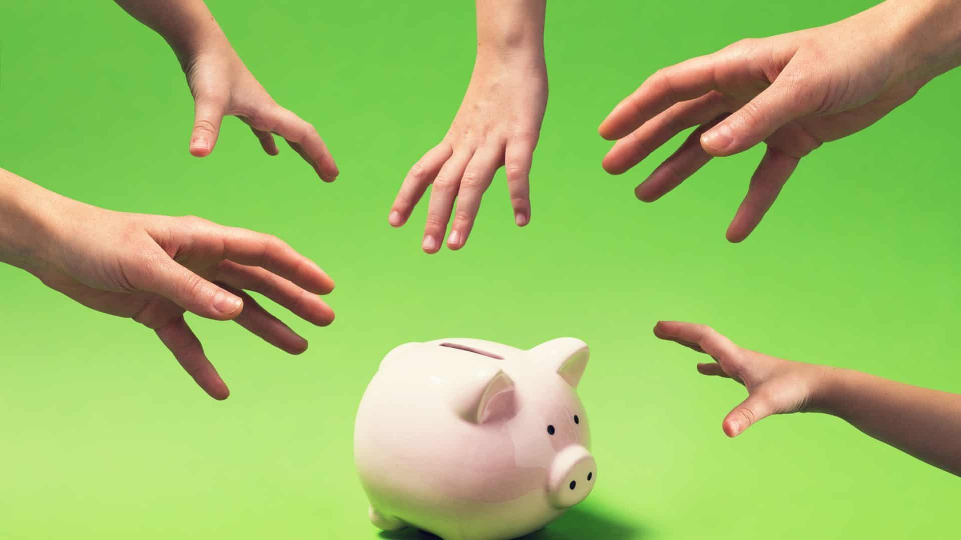 how to sell high ticket offers Hands reaching for a piggy bank.