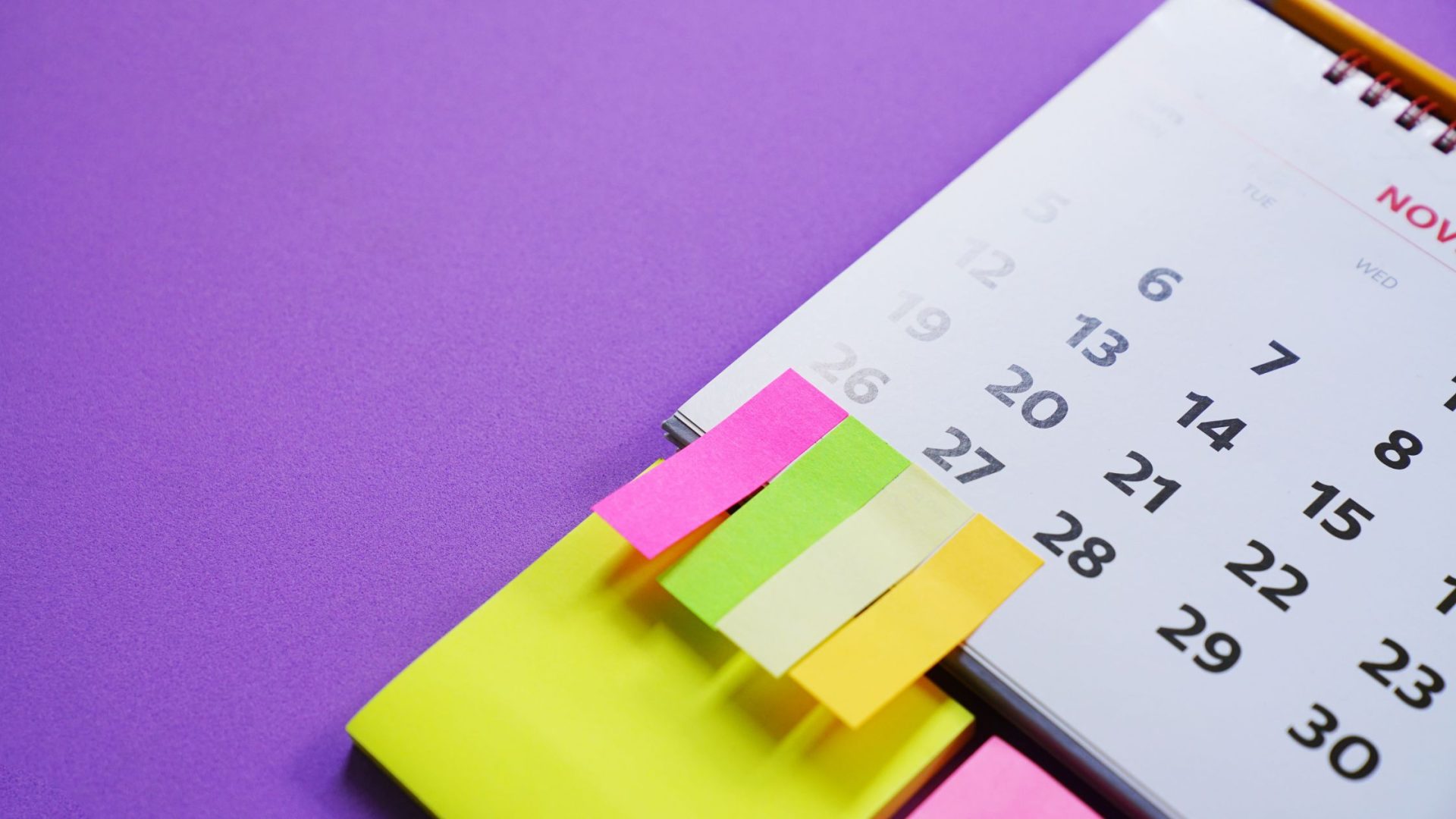 in-person event ideas for small business - calendar on purple background