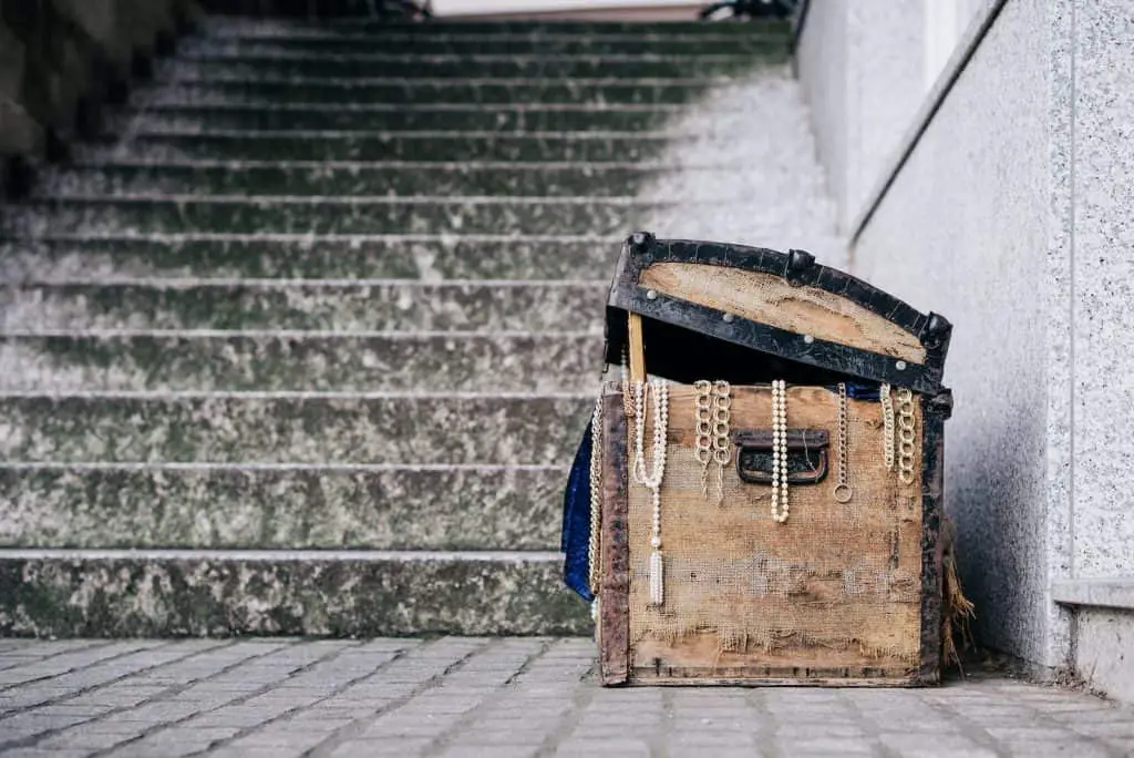 brown jewelry box beside concrete stairs