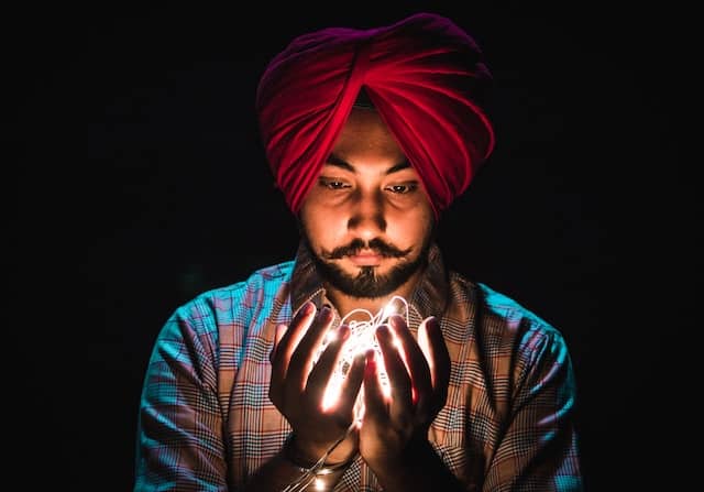 man with turban gazing at lights