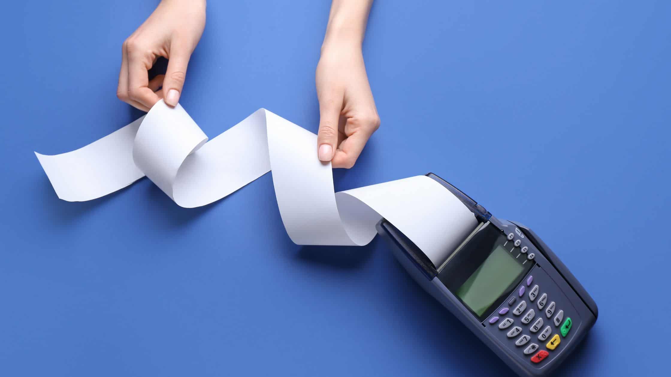 where to spend marketing money - a calculator with a person reviewing the numbers