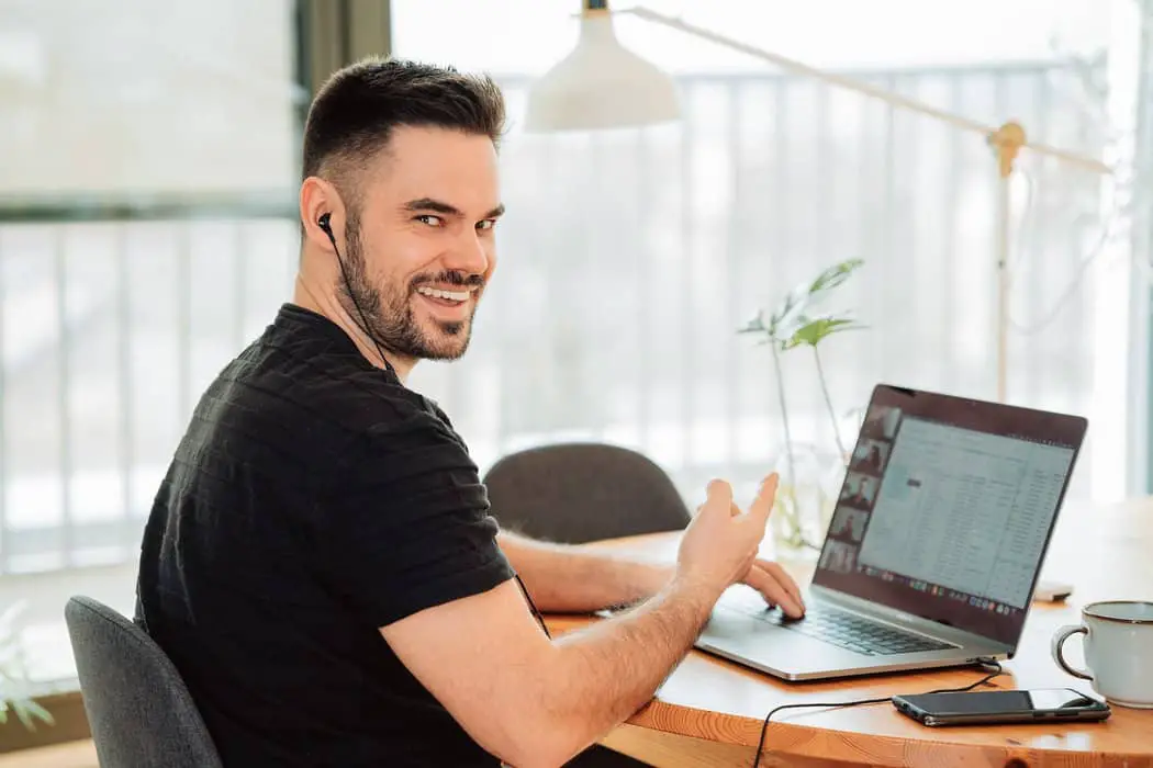 man in black t-shirt using macbook pro virtual events platform