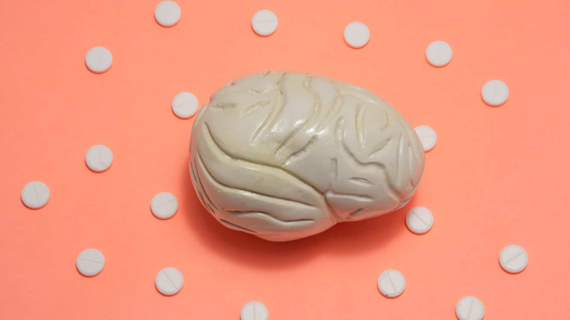 pricing psychology for small business Brain model surrounded by white pills