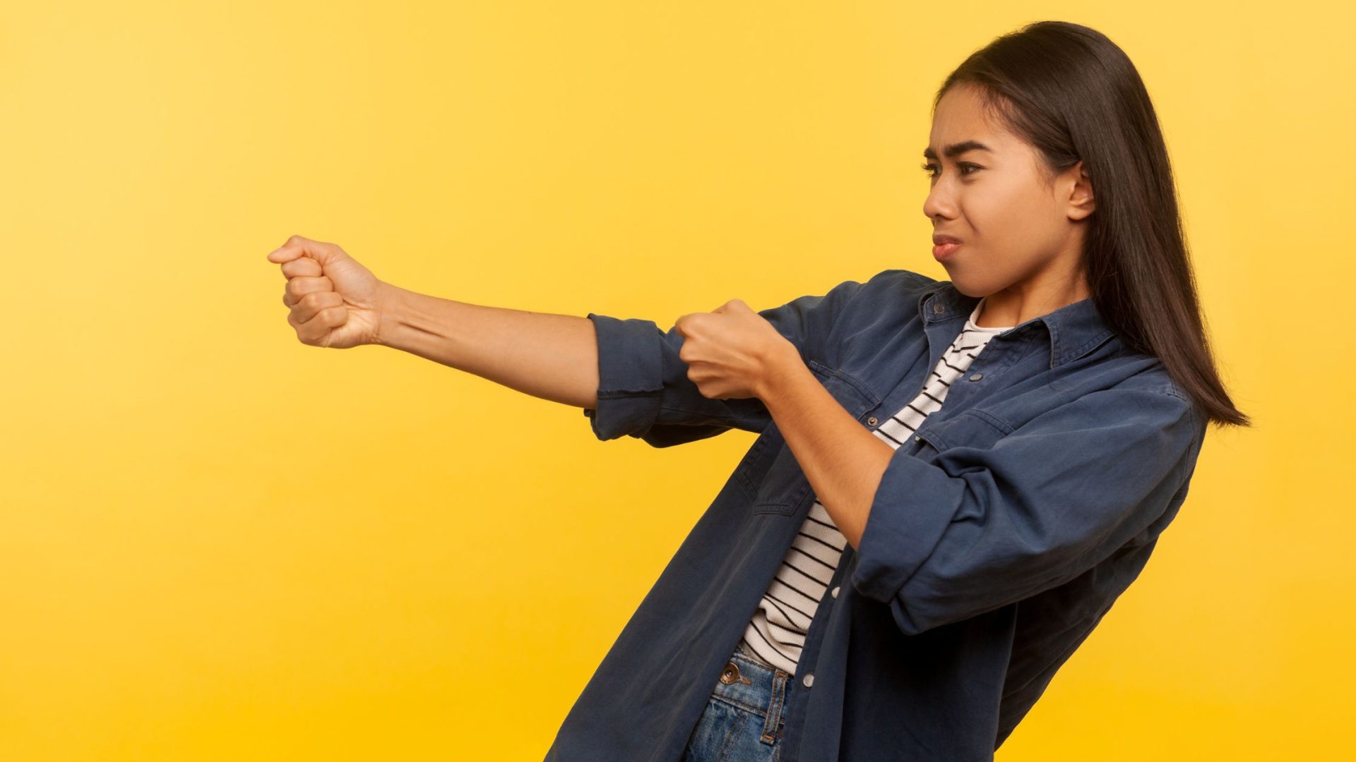 pull marketing strategies for small business - woman pulling invisible rope on yellow background