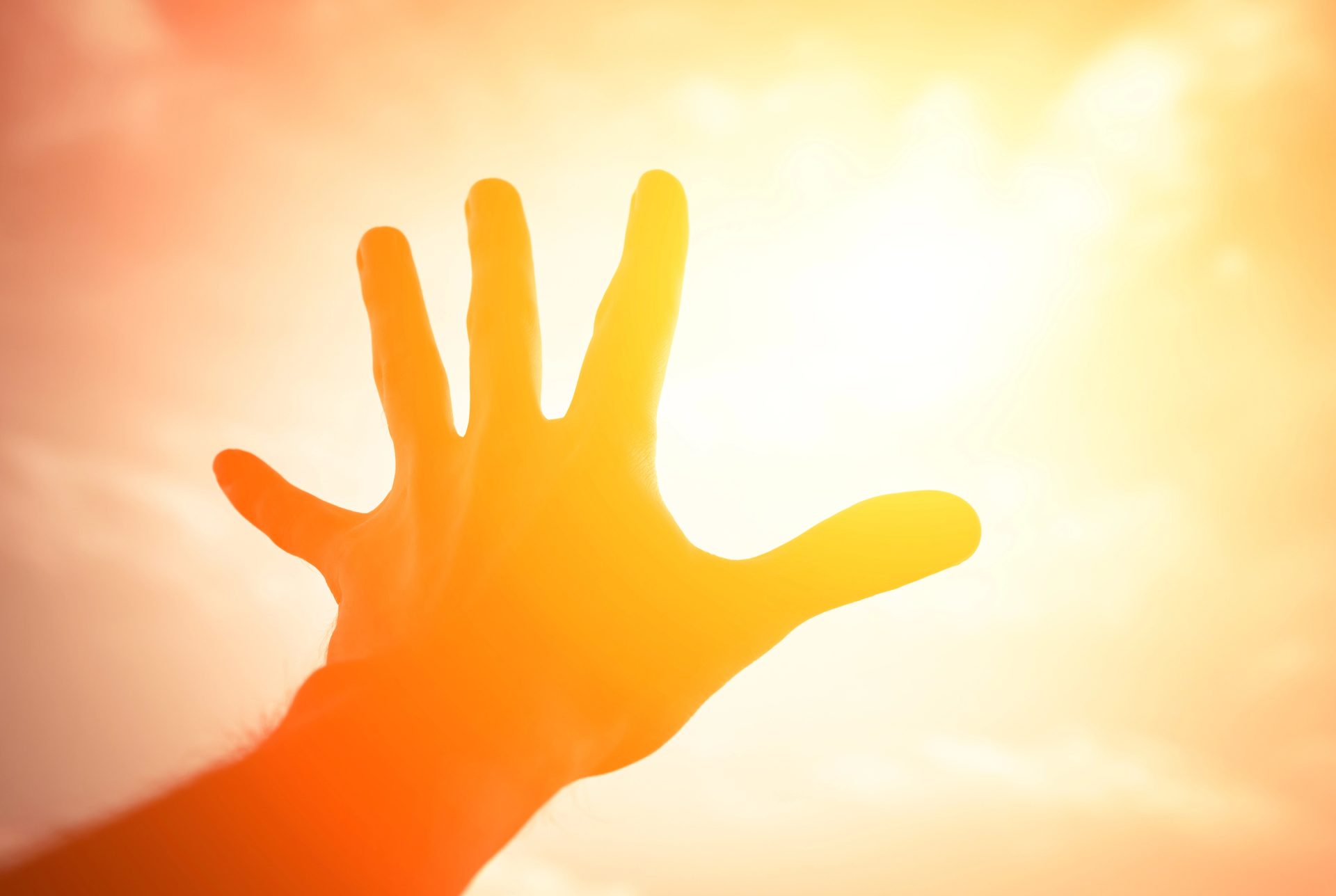 hand reaching into the sun - reaching your audience