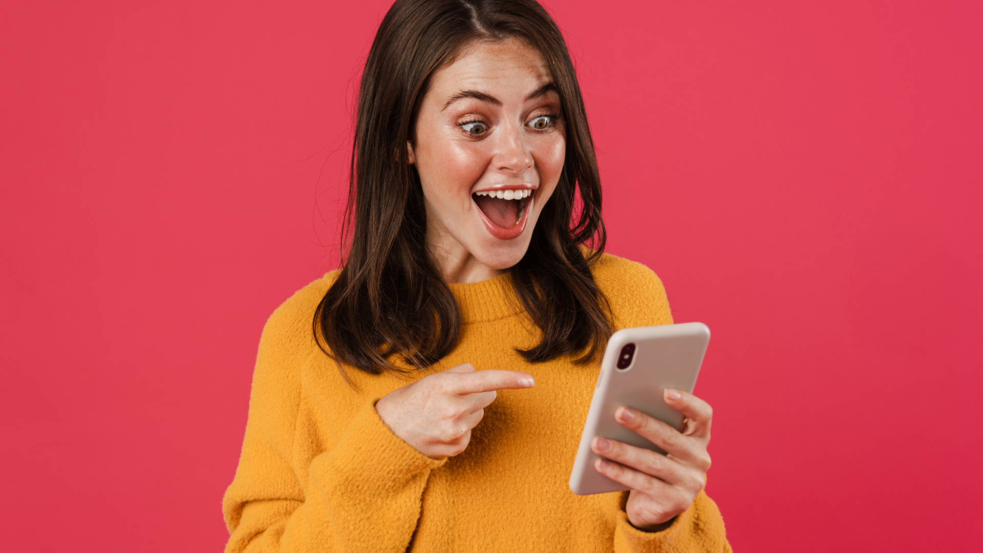 Man with beard in red shirt talking into iphone video tiktok vs youtube shorts video