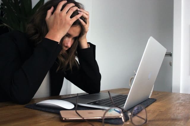 man frustrated with computer