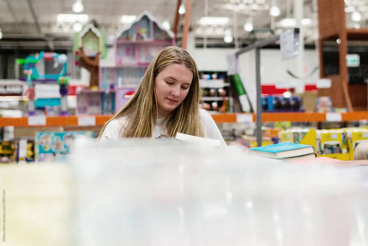 woman browsing in book store - book marketing ideas